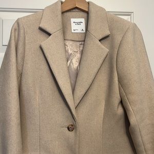 A&F wool blend blazer in M. Hits below hips. Warm.